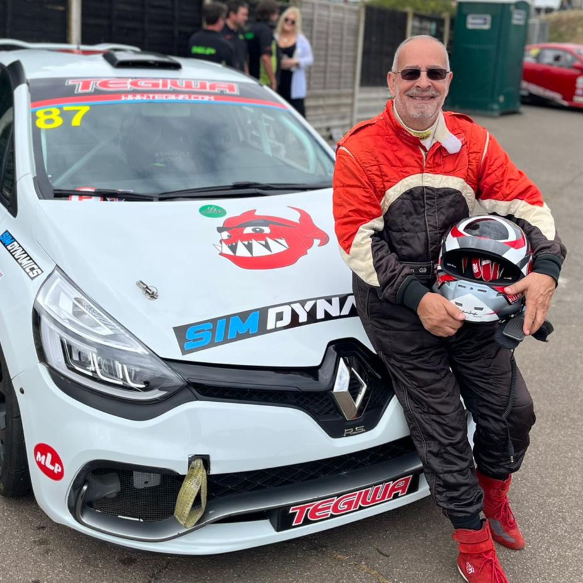 Chris Bialan leaning against Piranha Motorsports car